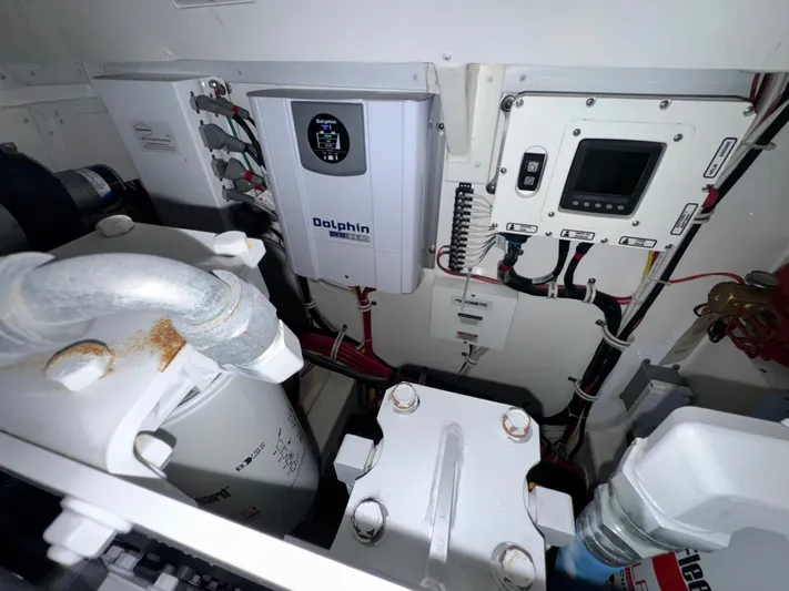 Wendy Ann Yacht Photos Pics Engine room of 2021 Albemarle 41 Express with Dolphin Pro 24.60 charger and control panel.