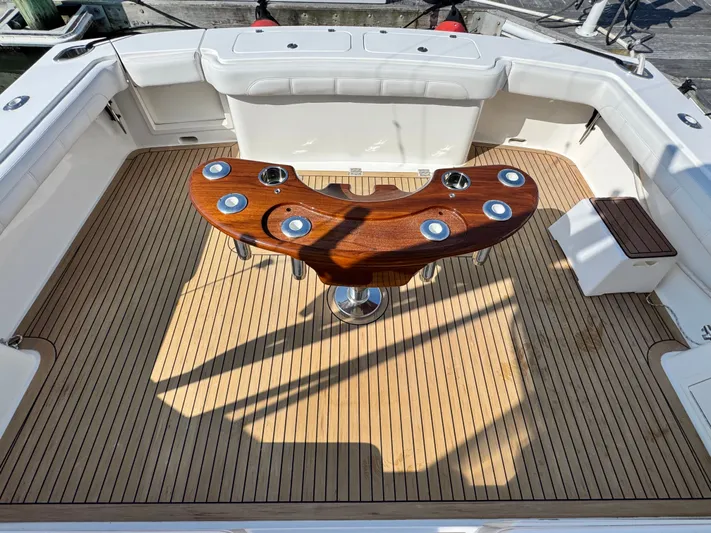 Wendy Ann Yacht Photos Pics 2021 Albemarle 41 Express boat deck with wooden table and seating.