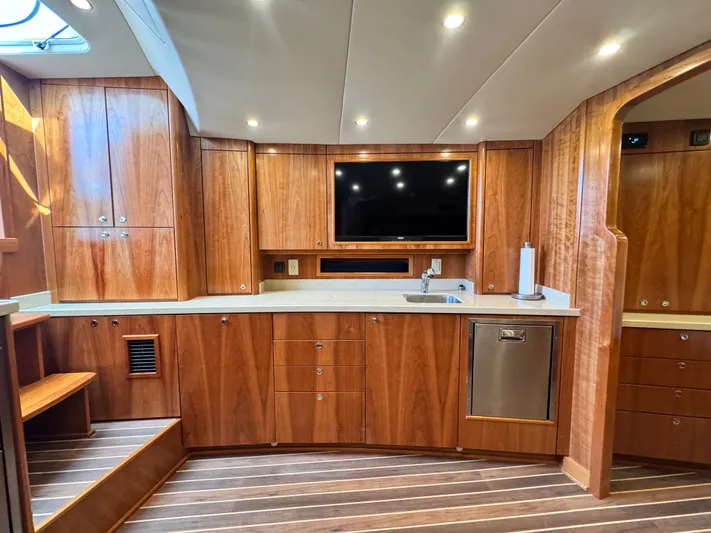 Wendy Ann Yacht Photos Pics Luxurious 2021 Albemarle 41 Express yacht interior with wood cabinetry and modern amenities.