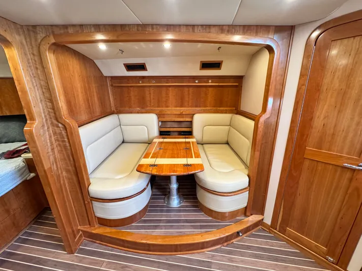 Wendy Ann Yacht Photos Pics Luxurious 2021 Albemarle 41 Express yacht interior with elegant wood finish and cozy seating area.