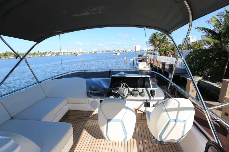 Ytf 002 Yacht Photos Pics 2024 Princess F45 yacht interior with helm, seating, and waterfront view.
