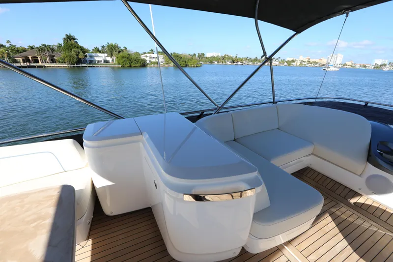 Ytf 002 Yacht Photos Pics 2024 Princess F45 yacht deck with luxurious seating and scenic waterfront view.