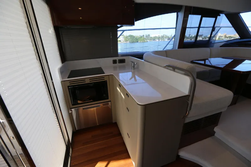 Ytf 002 Yacht Photos Pics Modern kitchen area in 2024 Princess F45 yacht with sleek design and appliances.