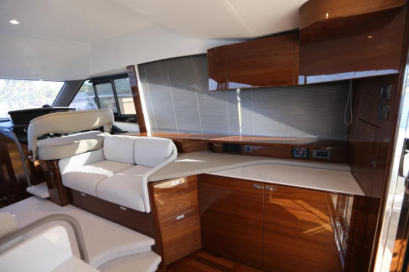 Ytf 002 Yacht Photos Pics Luxurious interior of 2024 Princess F45 yacht with elegant wood finishes and comfortable seating.