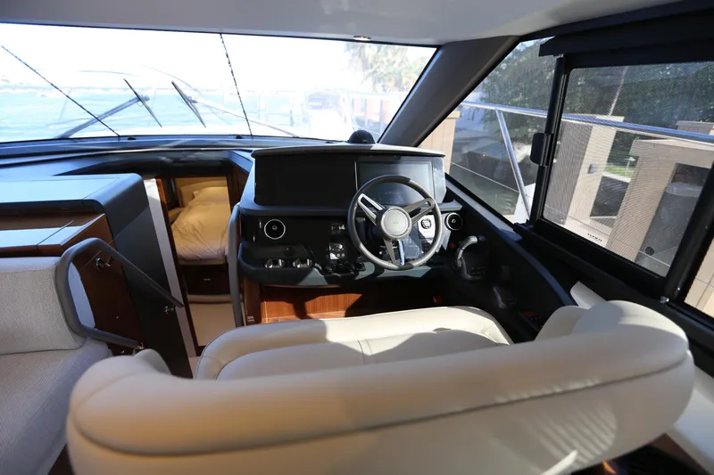 Ytf 002 Yacht Photos Pics Interior of 2024 Princess F45 yacht, featuring luxurious helm and seating area.