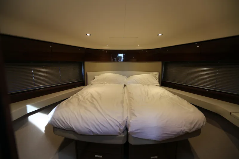Ytf 002 Yacht Photos Pics Luxurious bedroom interior of 2024 Princess F45 yacht with cozy bedding.