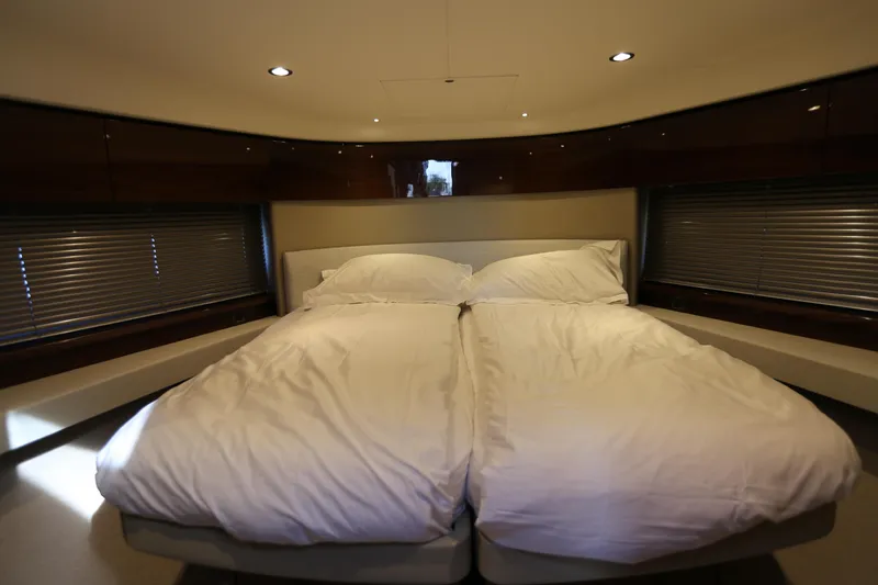 Ytf 002 Yacht Photos Pics Luxurious bedroom interior of 2024 Princess F45 yacht with cozy bedding.