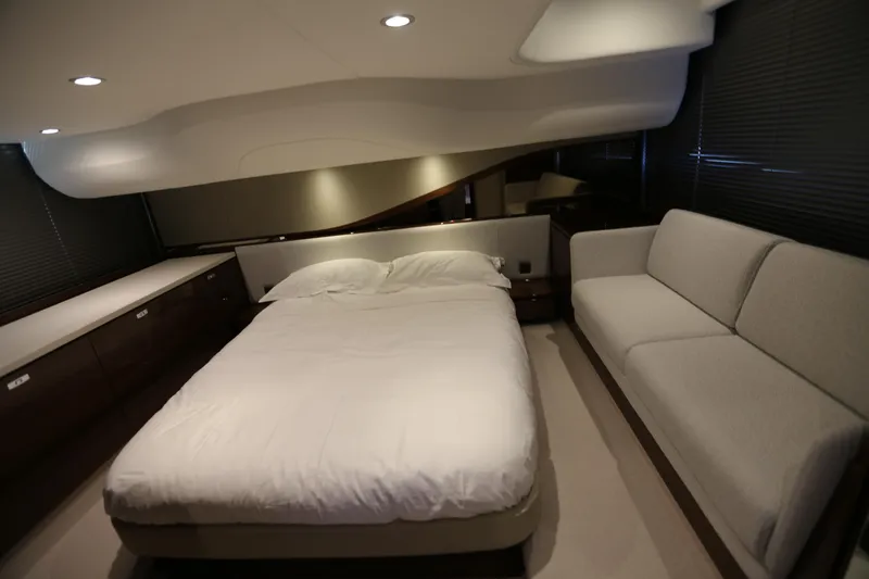 Ytf 002 Yacht Photos Pics Luxurious bedroom interior of 2024 Princess F45 yacht with bed and sofa.