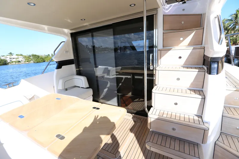 Ytf 002 Yacht Photos Pics 2024 Princess F45 yacht deck with seating, stairs, and sliding glass door.