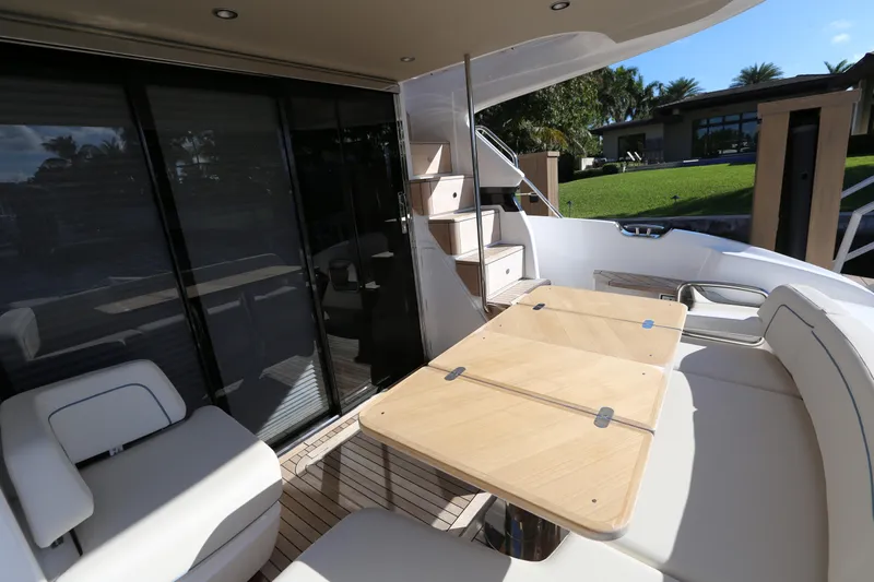 Ytf 002 Yacht Photos Pics 2024 Princess F45 yacht deck with seating and table, showcasing luxury outdoor space.