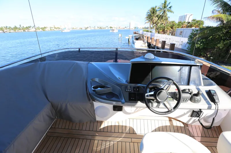 Ytf 002 Yacht Photos Pics 2024 Princess F45 yacht helm with modern controls and scenic waterfront view.