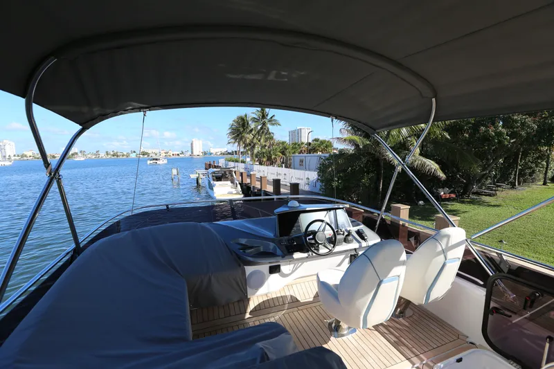 Ytf 002 Yacht Photos Pics 2024 Princess F45 yacht interior with waterfront view and lush greenery.