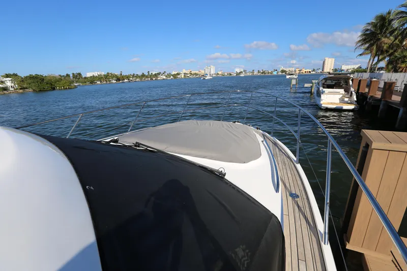 Ytf 002 Yacht Photos Pics 2024 Princess F45 yacht docked by scenic waterfront with clear blue skies.