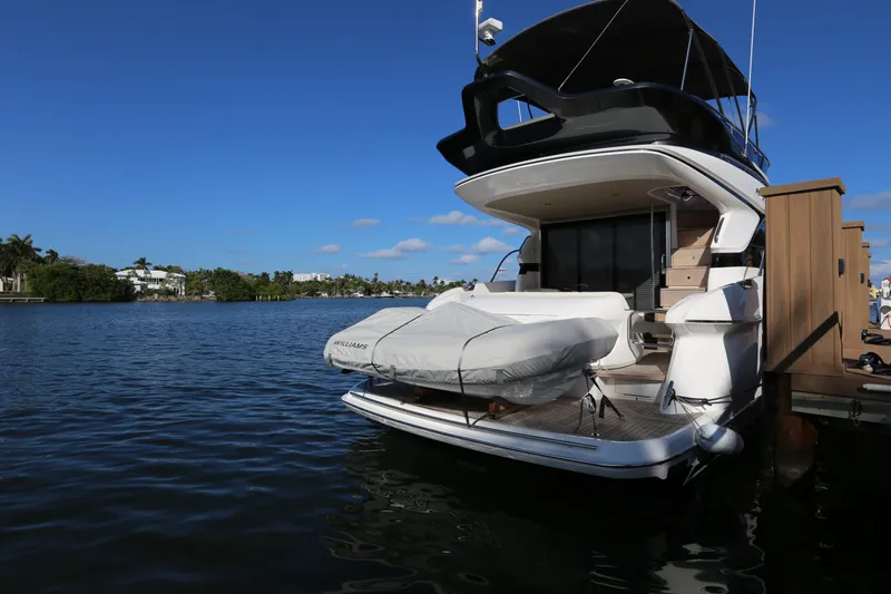 Ytf 002 Yacht Photos Pics 2024 Princess F45 yacht docked on a sunny waterfront.