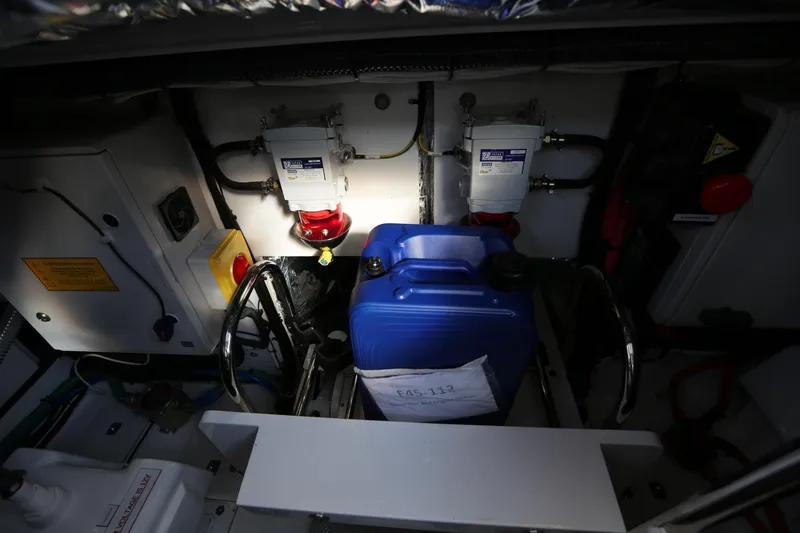 Ytf 002 Yacht Photos Pics Engine compartment of 2024 Princess F45 yacht with blue container and mechanical components.