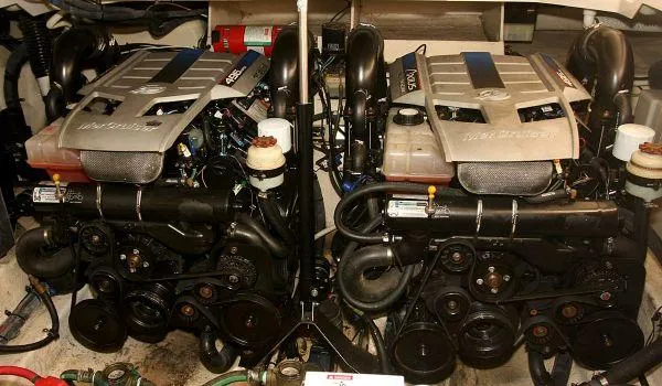 Blue Aye Yacht Photos Pics Twin engines of a 2008 Sea Ray 330 Sundancer boat in the engine compartment.