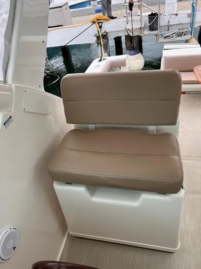  Yacht Photos Pics 2005 Tiara Yachts 3200 Open seating area with beige cushioned seat.