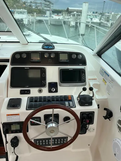  Yacht Photos Pics 2005 Tiara Yachts 3200 Open helm with navigation instruments and steering wheel.