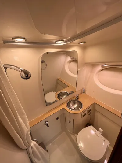  Yacht Photos Pics 2005 Tiara Yachts 3200 Open bathroom with sink, toilet, and mirror.