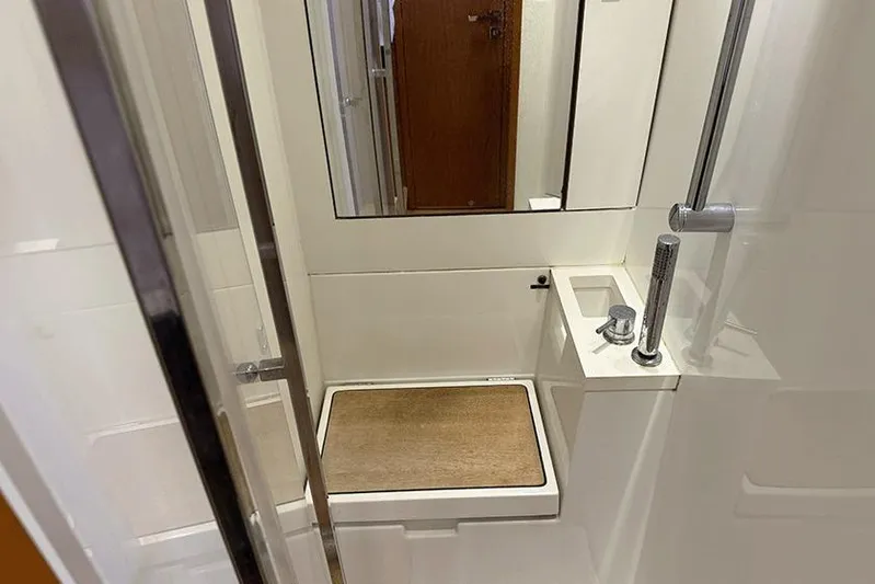  Yacht Photos Pics Bathroom interior of 2013 Beneteau Sense 55 yacht, featuring modern shower and fixtures.