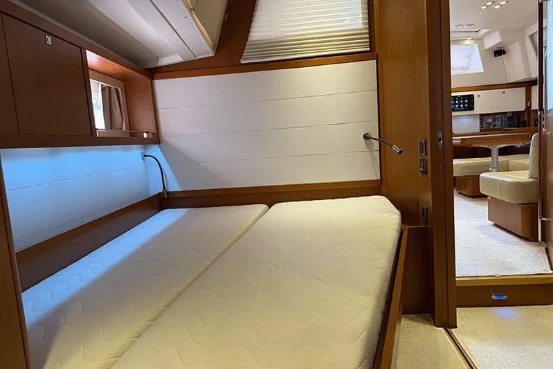  Yacht Photos Pics Luxurious interior of 2013 Beneteau Sense 55 yacht with cozy cabin and modern furnishings.