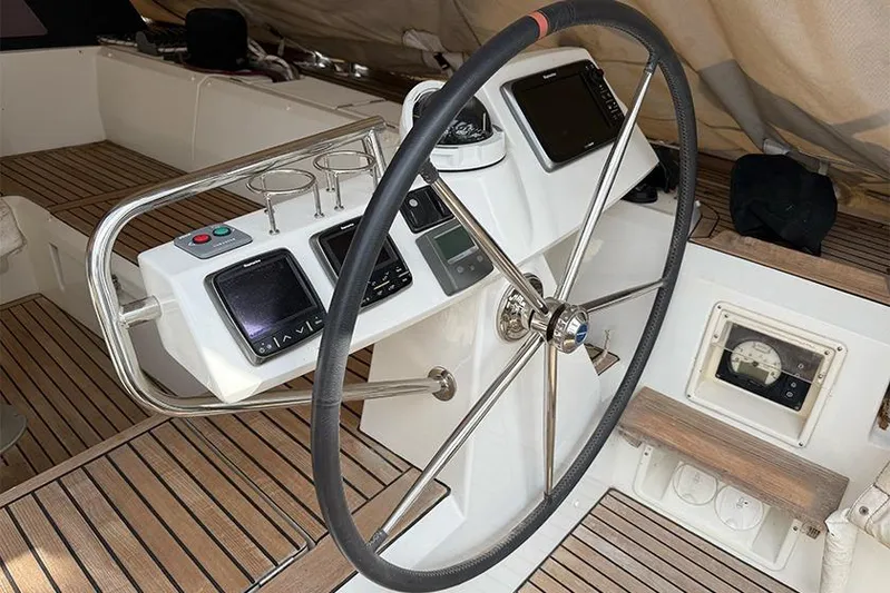  Yacht Photos Pics Steering wheel and controls of 2013 Beneteau Sense 55 yacht cockpit.