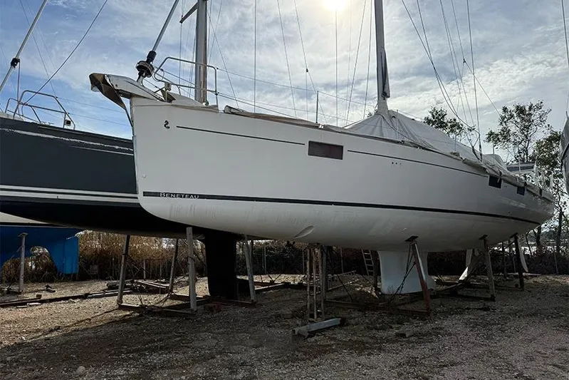  Yacht Photos Pics 2013 Beneteau Sense 55 sailboat on dry dock under a clear sky.