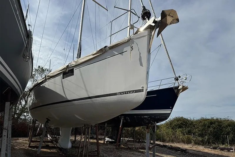  Yacht Photos Pics 2013 Beneteau Sense 55 sailboat on dry dock, side view.