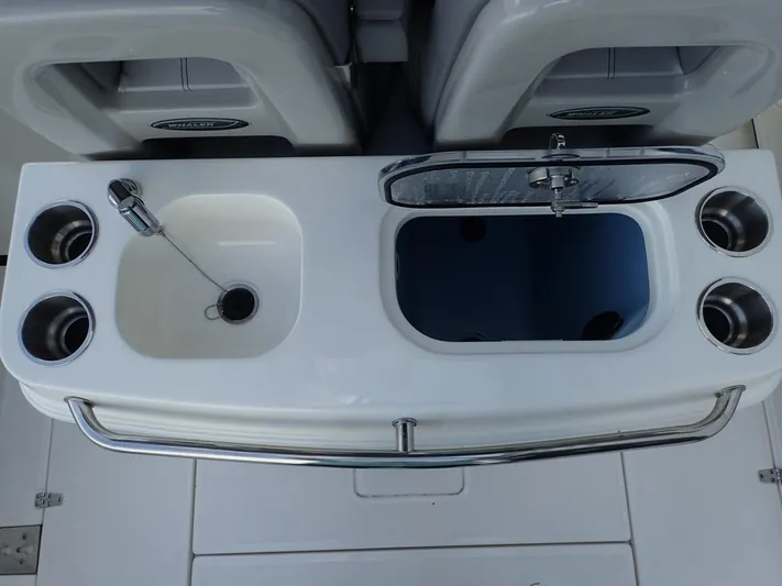  Yacht Photos Pics 2023 Boston Whaler 280 Outrage boat sink and storage area with cup holders.