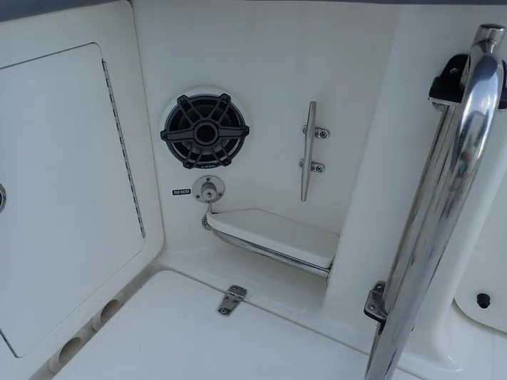  Yacht Photos Pics 2023 Boston Whaler 280 Outrage boat interior with speaker and storage compartment.