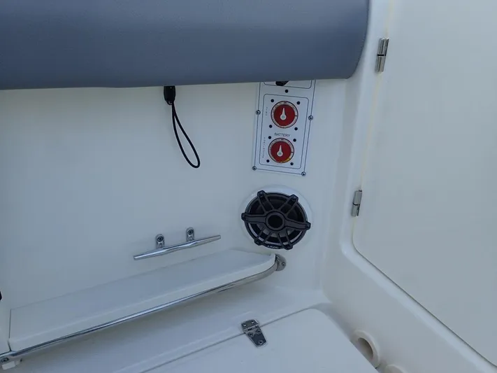  Yacht Photos Pics 2023 Boston Whaler 280 Outrage interior with control panel and speaker.