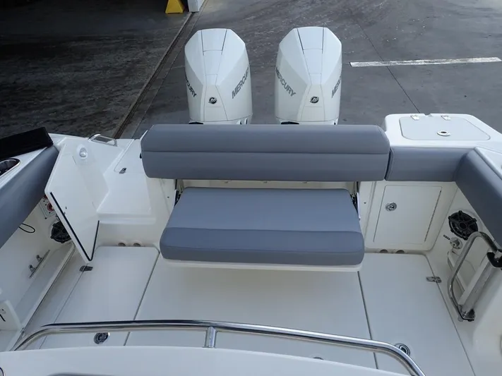  Yacht Photos Pics 2023 Boston Whaler 280 Outrage boat with dual Mercury engines and cushioned seating.