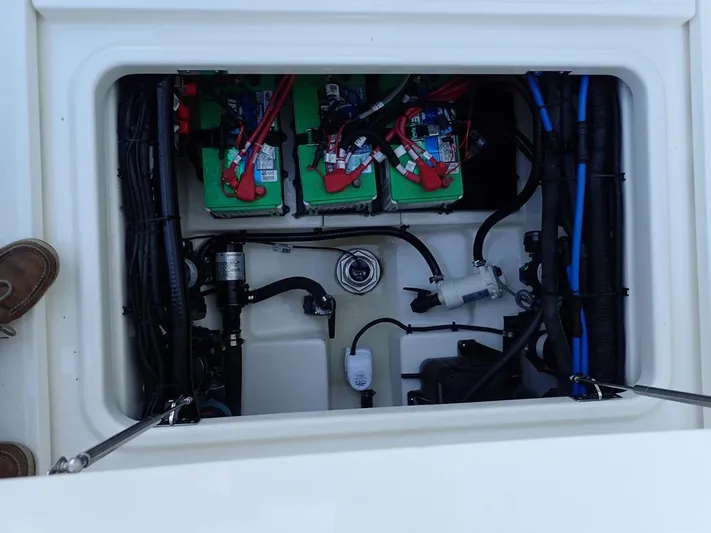  Yacht Photos Pics 2023 Boston Whaler 280 Outrage battery compartment with wiring and components.