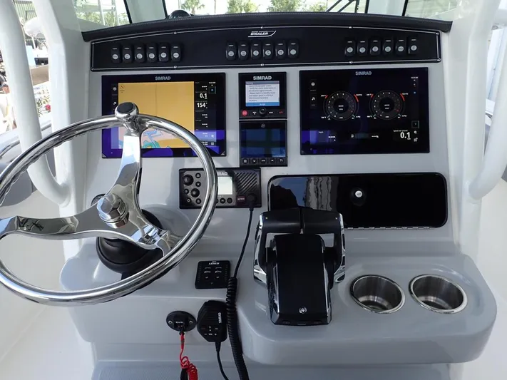  Yacht Photos Pics 2023 Boston Whaler 280 Outrage helm with advanced navigation displays and controls.