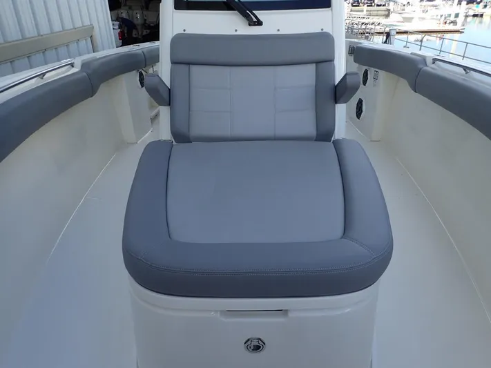  Yacht Photos Pics 2023 Boston Whaler 280 Outrage boat with gray cushioned seating.