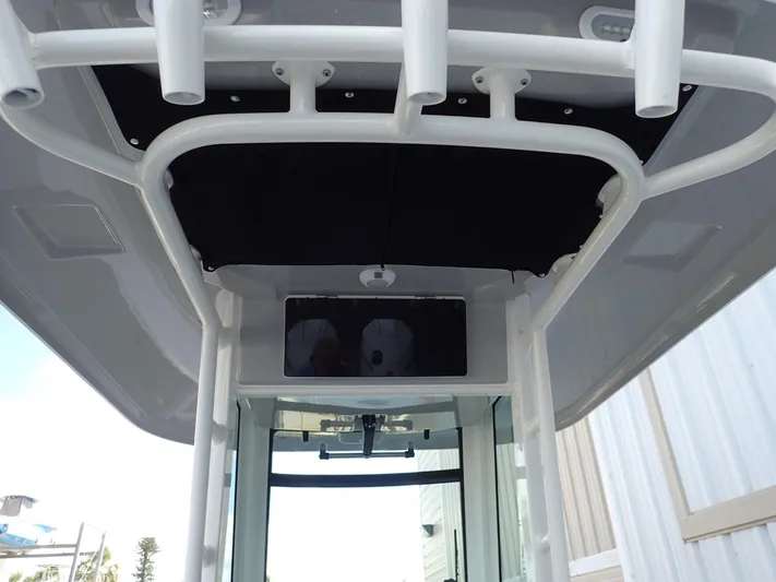  Yacht Photos Pics 2023 Boston Whaler 280 Outrage boat, featuring a sleek overhead console and rod holders.