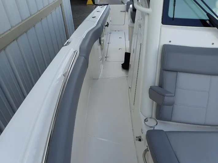  Yacht Photos Pics 2023 Boston Whaler 280 Outrage interior with gray seating and sleek design.