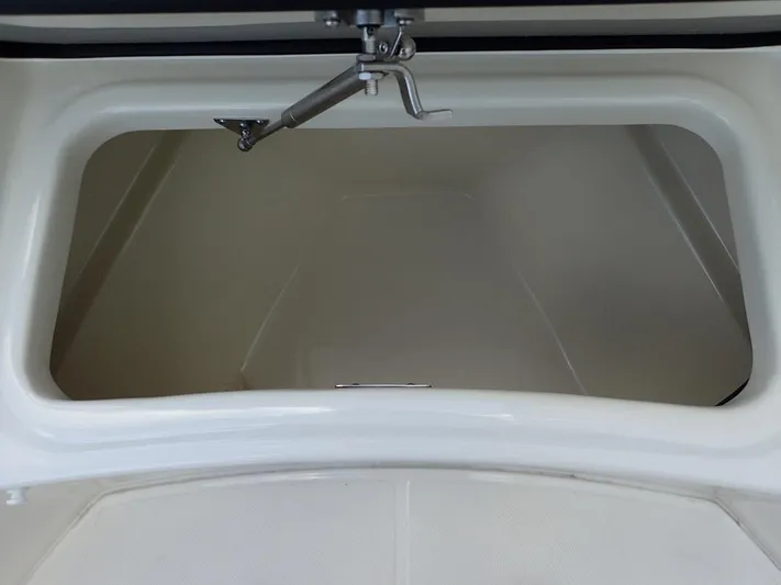  Yacht Photos Pics Storage compartment of 2023 Boston Whaler 280 Outrage boat, open and empty.