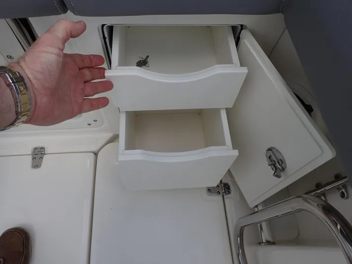  Yacht Photos Pics 2023 Boston Whaler 280 Outrage storage drawers and compartment detail.