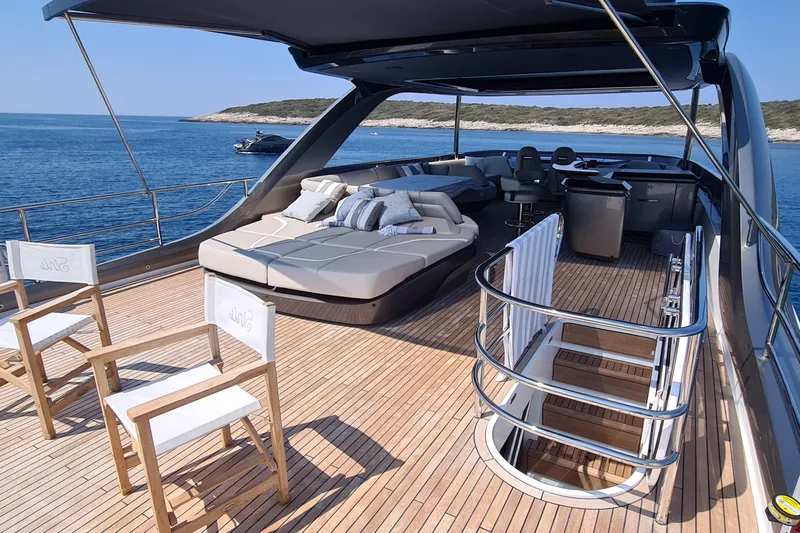  Yacht Photos Pics Luxurious 2022 Princess Y85 yacht deck with sun loungers and ocean view.