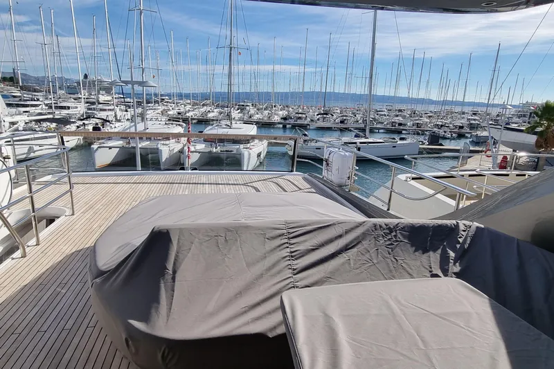  Yacht Photos Pics Luxury yacht Princess Y85, 2022 model, docked in a marina with numerous sailboats.