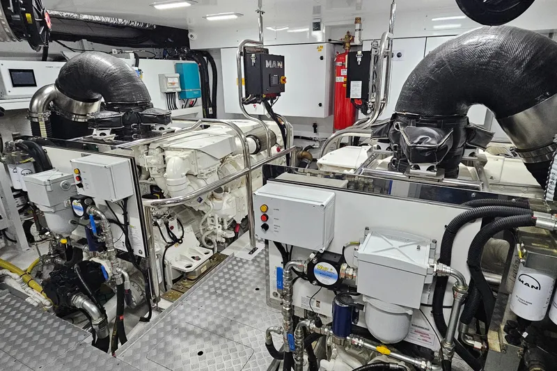  Yacht Photos Pics Engine room of a 2022 Princess Y85 yacht, featuring advanced machinery and equipment.