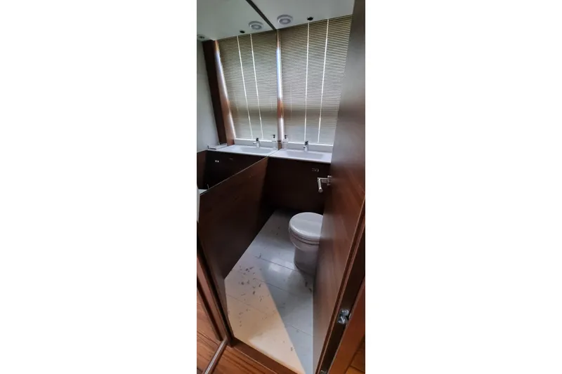  Yacht Photos Pics Luxurious bathroom in 2022 Princess Y85 yacht with modern fixtures and elegant design.