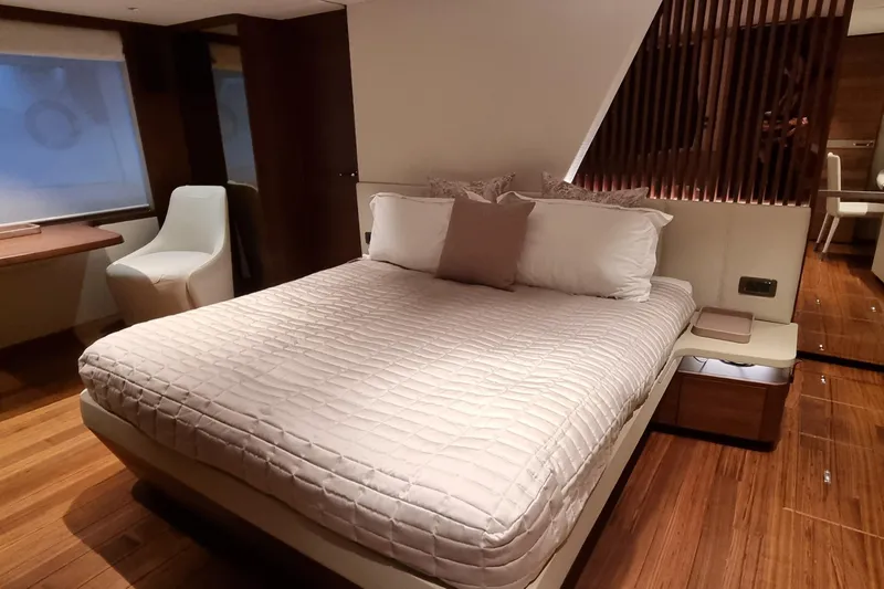  Yacht Photos Pics Luxurious bedroom interior of 2022 Princess Y85 yacht with modern design and elegant furnishings.
