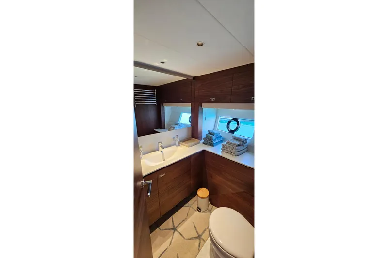  Yacht Photos Pics Luxurious bathroom interior of 2022 Princess Y85 yacht with modern fixtures and elegant design.