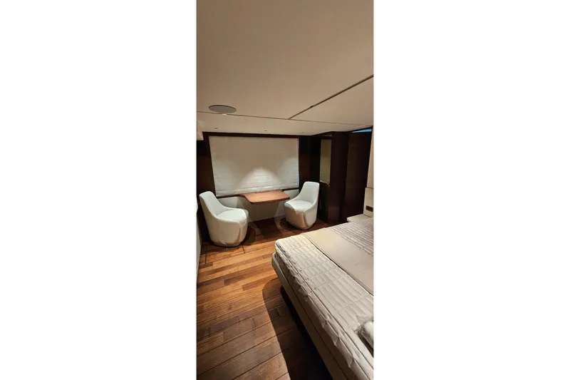  Yacht Photos Pics Luxurious interior of 2022 Princess Y85 yacht with elegant seating and wooden flooring.