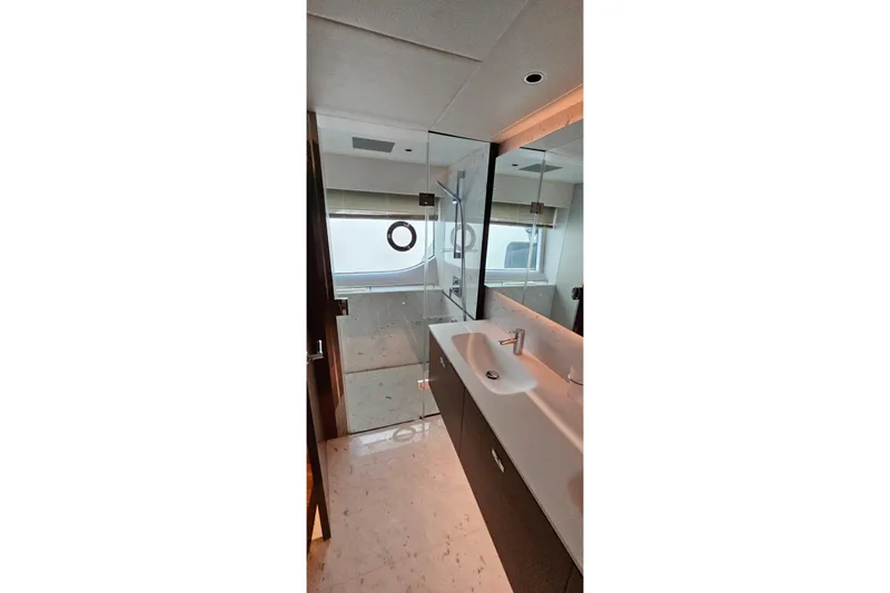  Yacht Photos Pics Luxurious bathroom in 2022 Princess Y85 yacht with modern fixtures and elegant design.