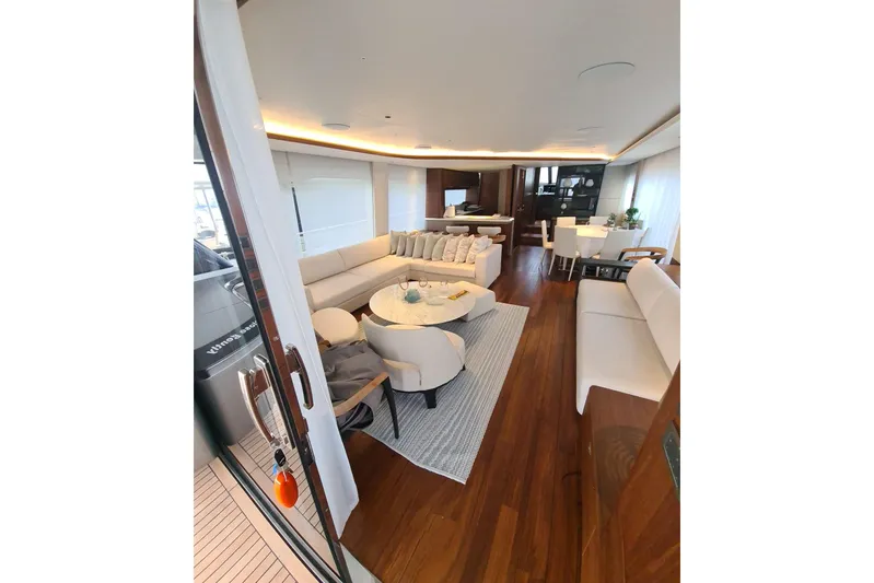  Yacht Photos Pics Luxurious interior of 2022 Princess Y85 yacht with elegant seating and dining area.