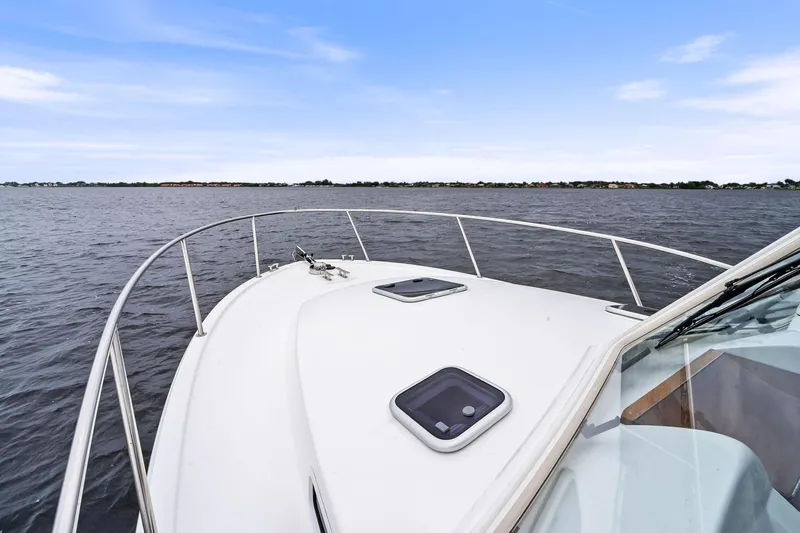 Tumalum Yacht Photos Pics 2023 MJM 35 yacht cruising on open water under clear blue sky.