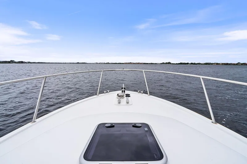 Tumalum Yacht Photos Pics Bow view of 2023 MJM 35 yacht cruising on open water.